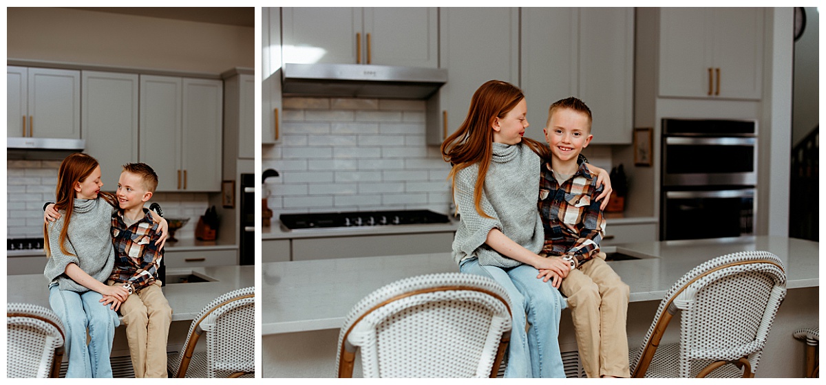 siblings sit together on counter during styled family shoot