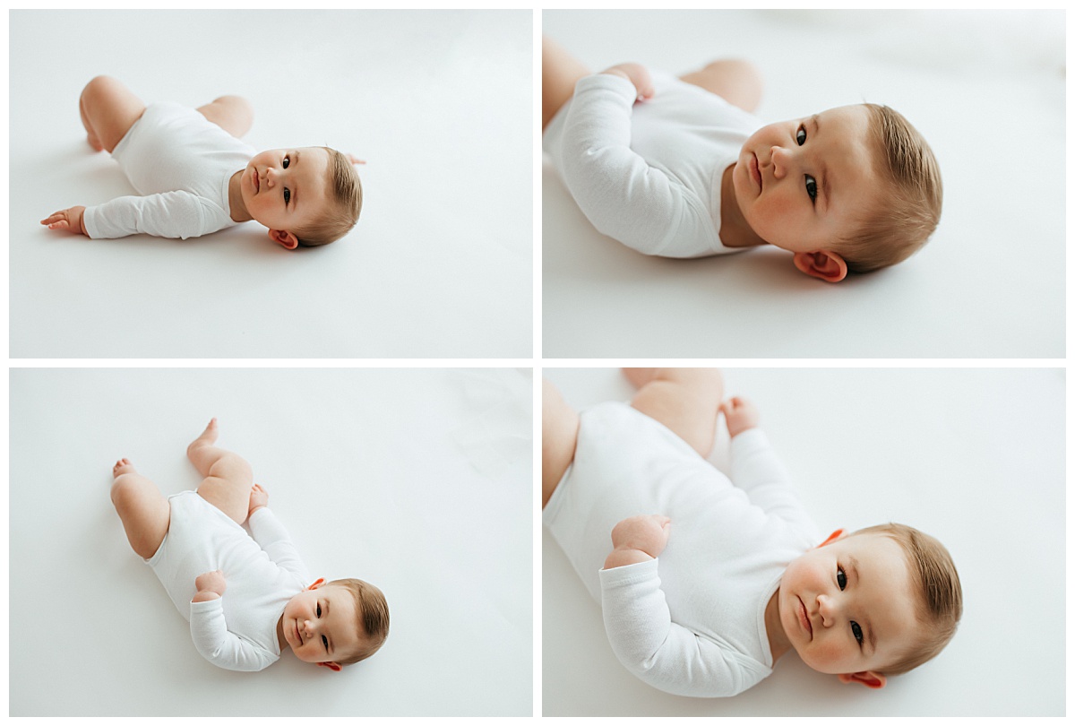 baby boy lays on floor looking up at minimal sitter milestone session