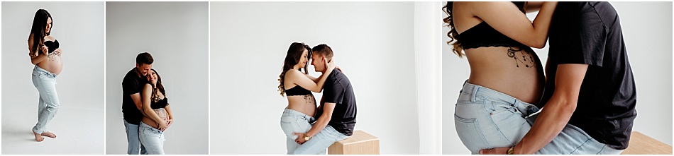 Pregnant mom wearing black bralette and jeans to show off her baby bump for a Denver maternity session with husband